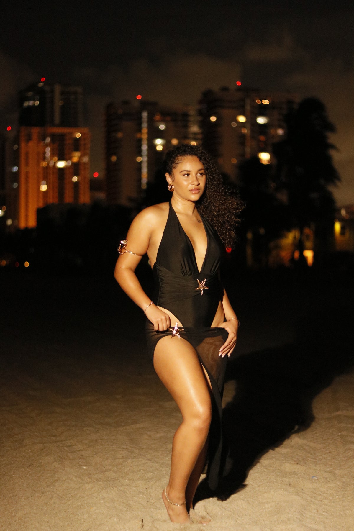 The Eclipse Dress: floor-length liquid-black column with plunging neckline