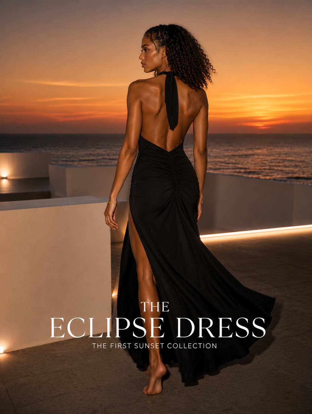 Back view of the black Eclipse Dress showing the open back and full-length skirt